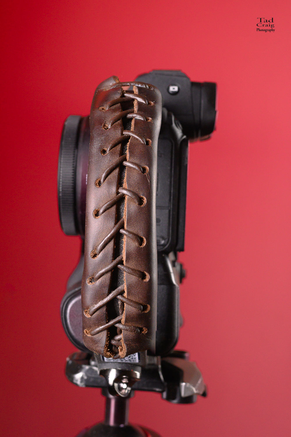 Brown Laced leather over on Camera Handle mounted on a tripod