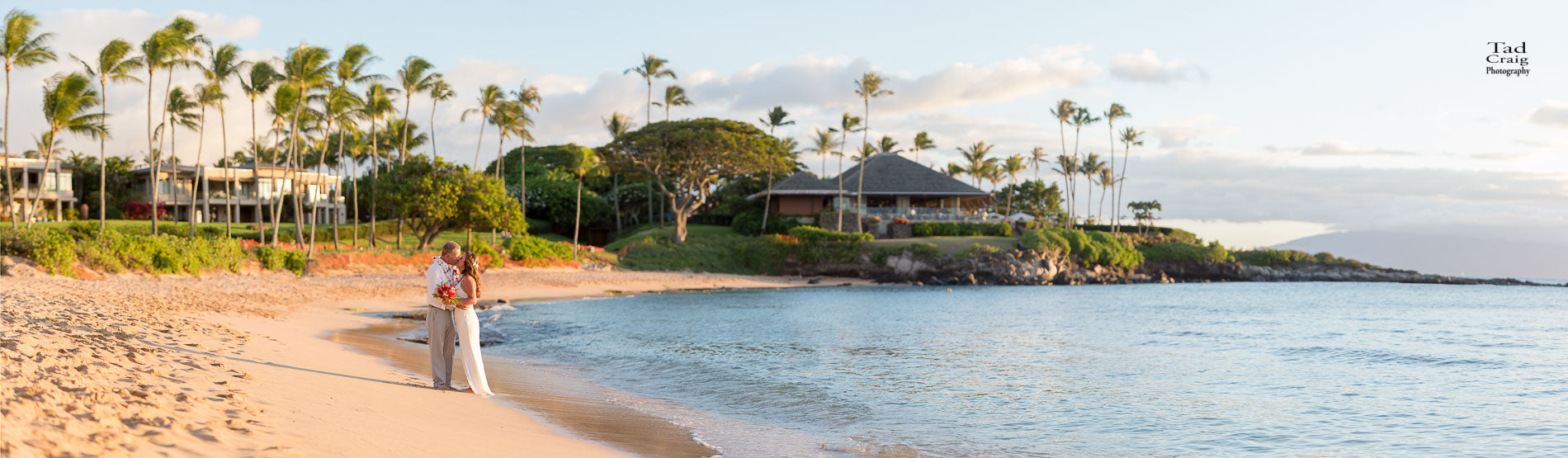 Couple kissing on an empty Maui Beach